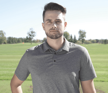 Professional portrait of Sean Carlino wearing a grey polo shirt, standing outdoors with a blurred green golf course and trees in the background.