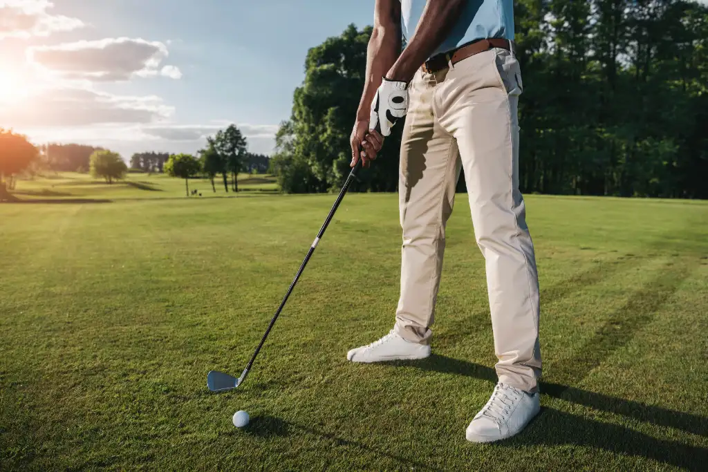 cropped-shot-of-golfer-holding-club-and-hitting-ba-2026-03-13-01-23-31-utc