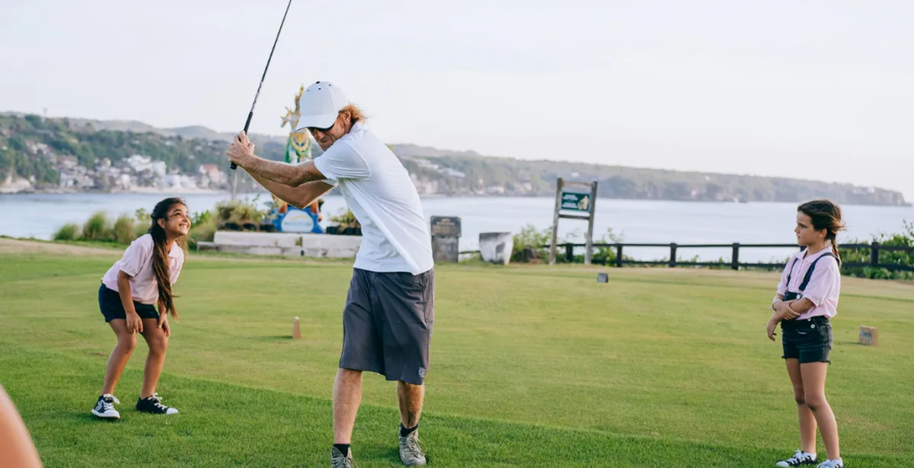 a guy swinging a driver
